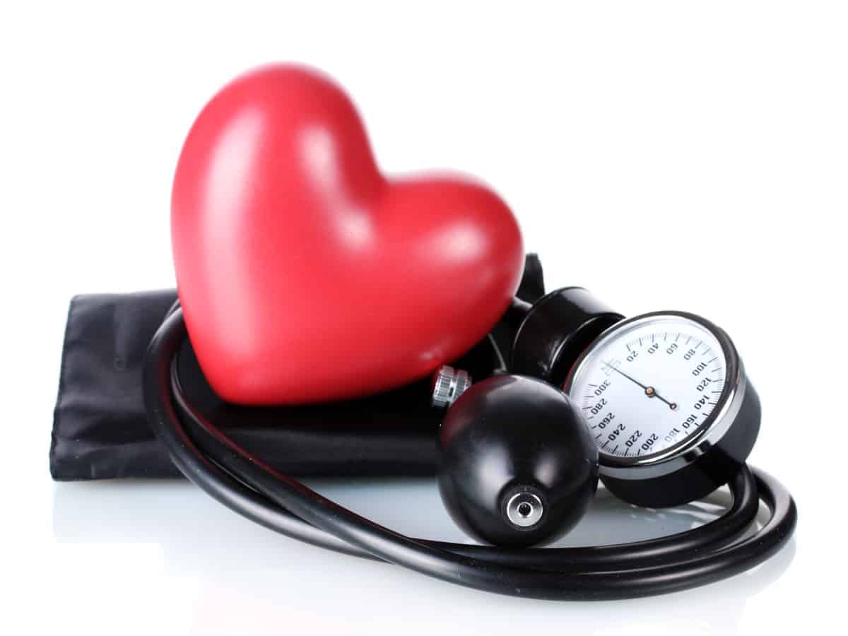 Red heart with blood pressure monitor