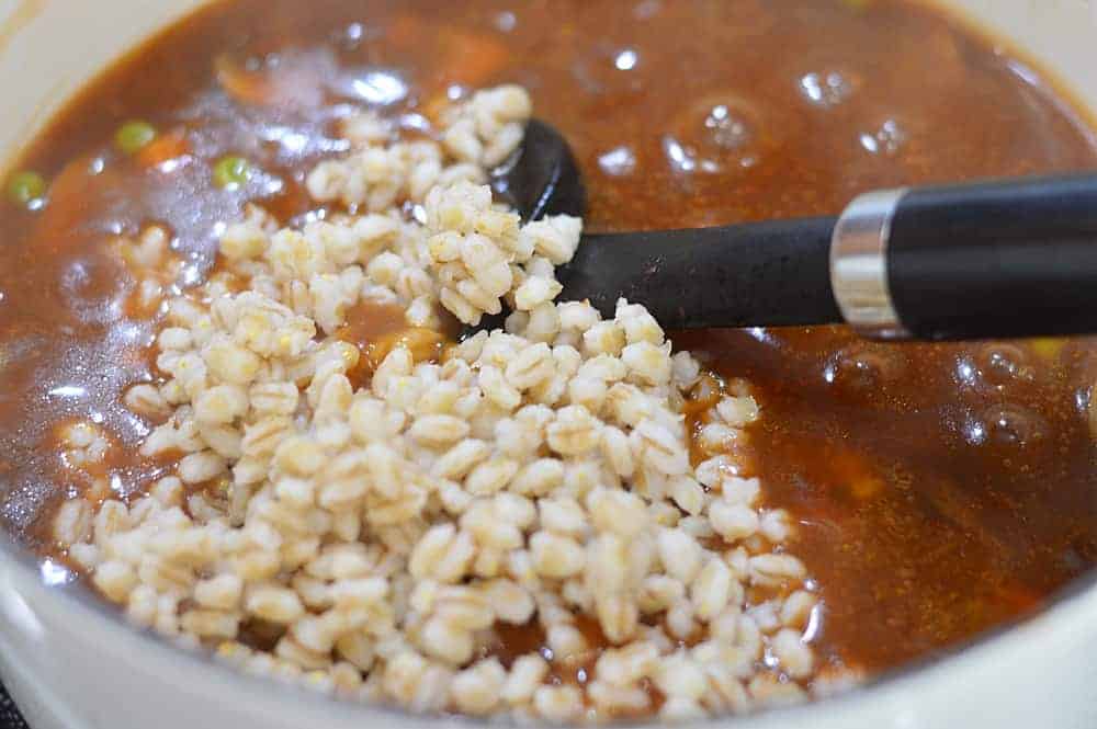 Adding barley to the soup