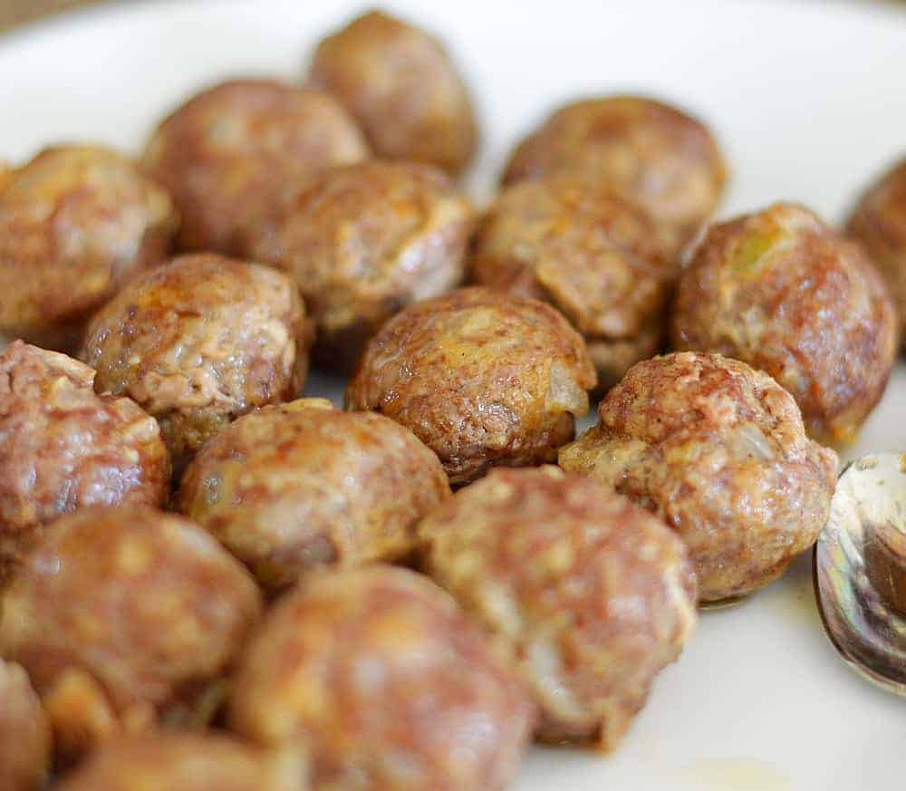 Fully baked meatballs on a white paper towel