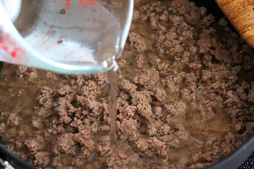 Adding water to the browned ground beef