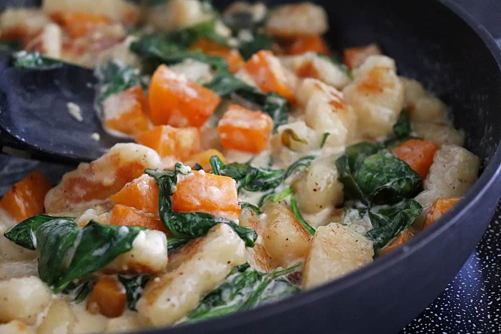 Close up of Creamy Gnocchi with Butternut Squash and Spinach