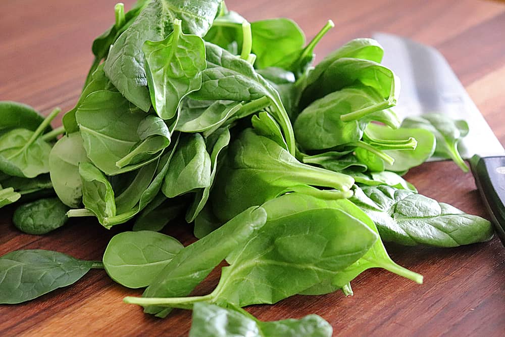 Adding fresh spinach