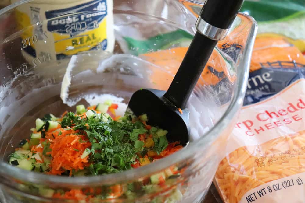 Adding carrots, cucumber and parsley