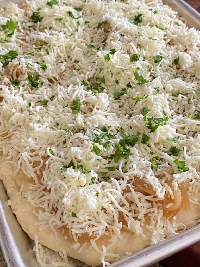 Add shredded cheese for Caramelized Onion Focaccia