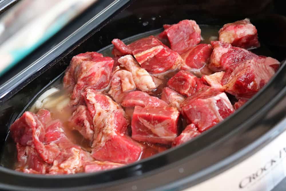 Add chuck roast to the slow cooker for Slow Cooker Beef Stroganoff