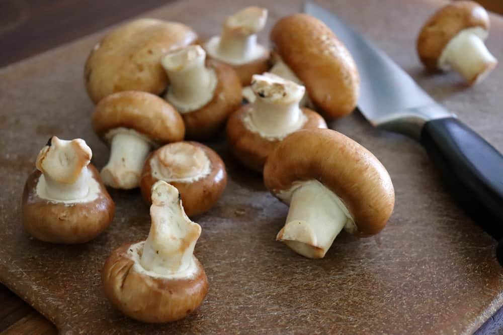 Slice mushrooms for Slow Cooker Beef Stroganoff