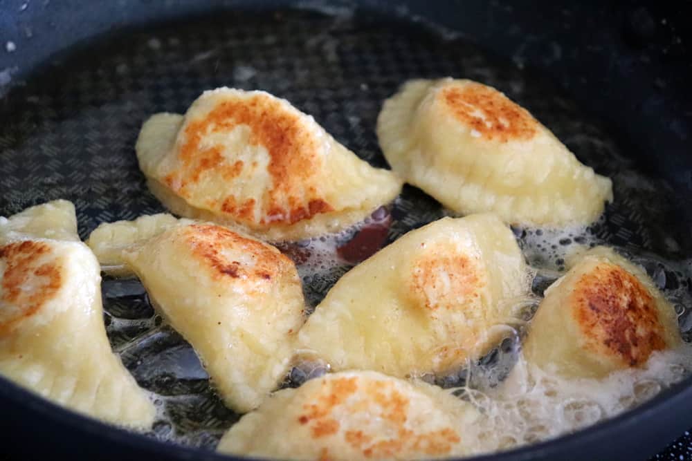 Pan frying the pierogi in butter