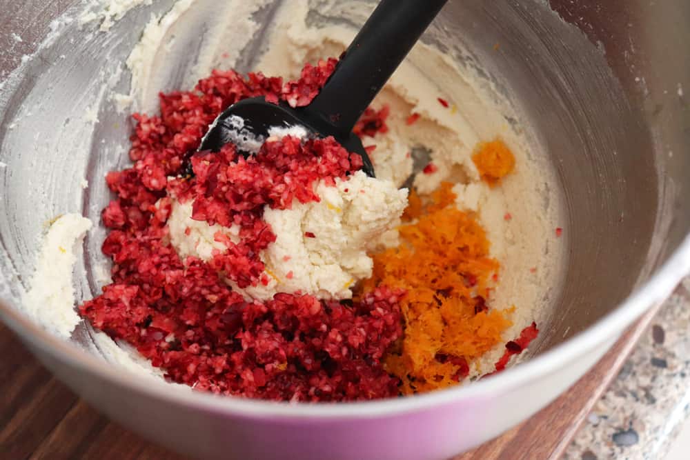 fold the chopped cranberries and orange zest into the batter
