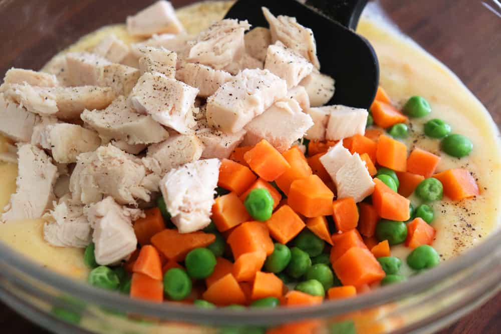 Add rotisserie chicken and vegetables