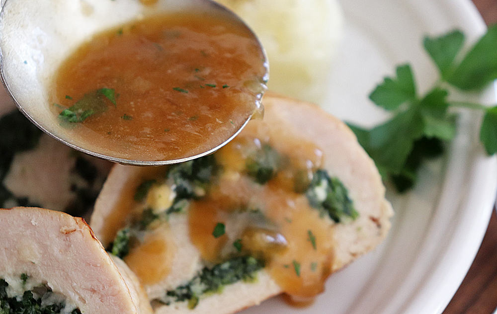 Add sauce to Spinach and Feta Turkey Roulade