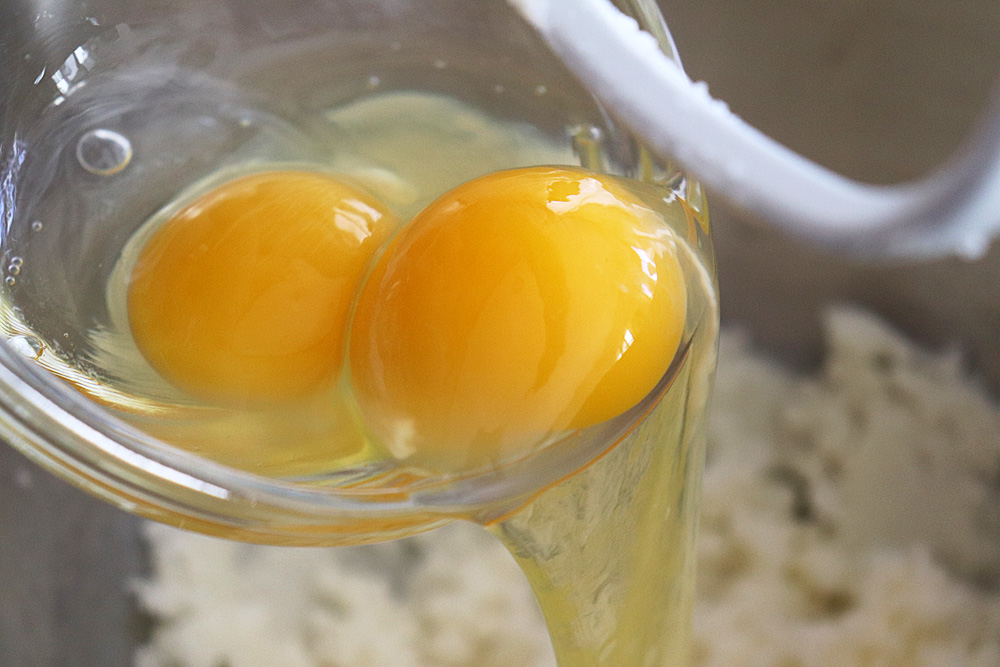 Add eggs to butter and sugar mixture