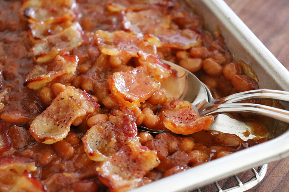 Spoon in The Best Baked Beans with Bacon