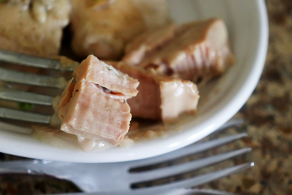 Bite shot of Creamy Slow Cooker Pork Chops