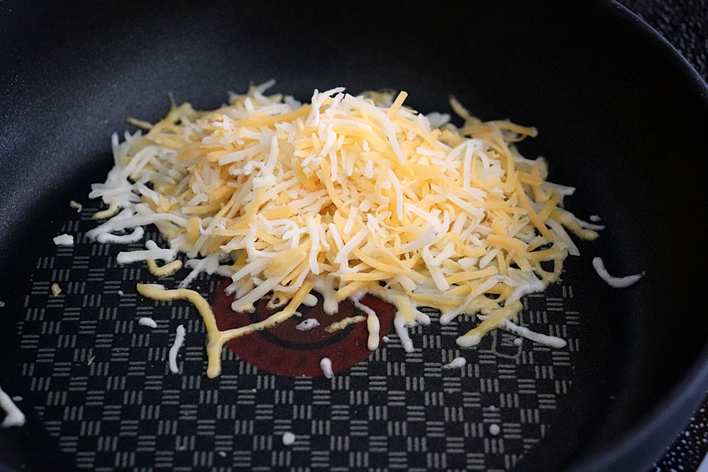 Add cheese to a pan to melt for the topping