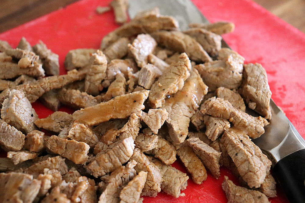 Cooked and cut steak strips